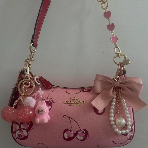 Pink Coach shoulder bag with cherries, pearls, and...