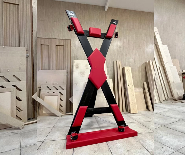 St. Andrew's BDSM cross with footrest. Adult furniture for the Play Room
