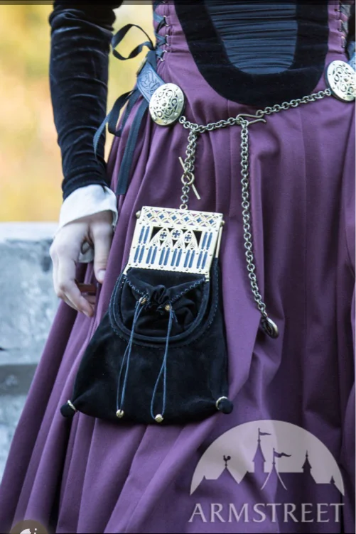 “Renaissance Memories” suede bag with a brass frame