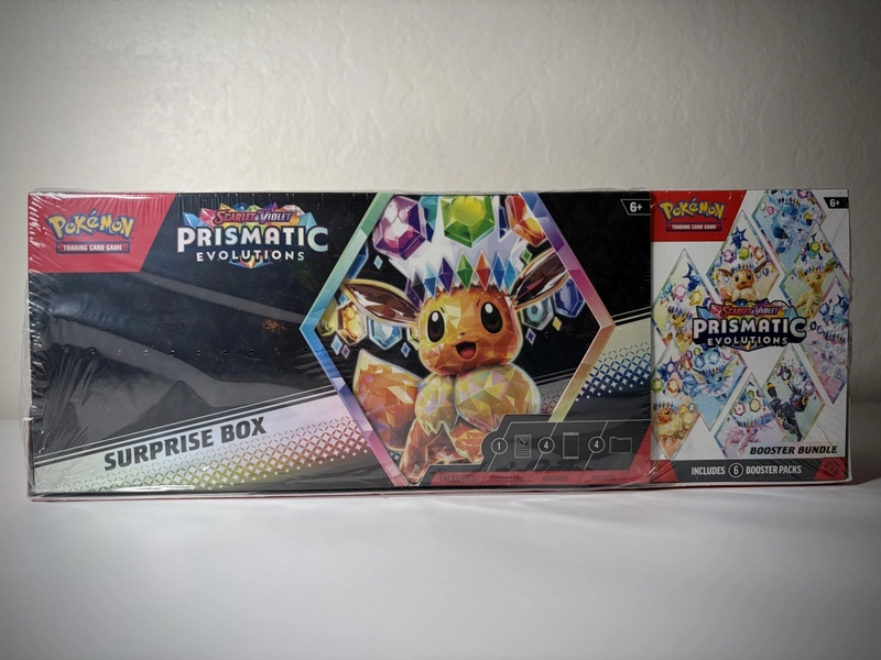 Pokémon Prismatic Evolutions Surprise Box + Booster Bundle