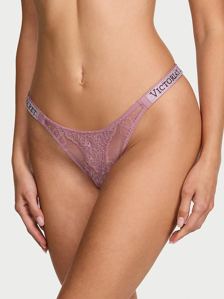 Panti brasilera de encaje con abertura y tiras brillantes