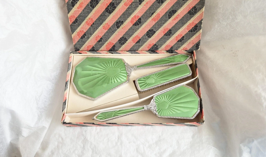Boxed vintage 3 piece chrome vanity set, embellished with attractive green patterned fascias, clothes brush, hair brush and mirror-1950s
