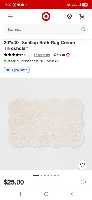 Cream-colored scalloped Bath rug