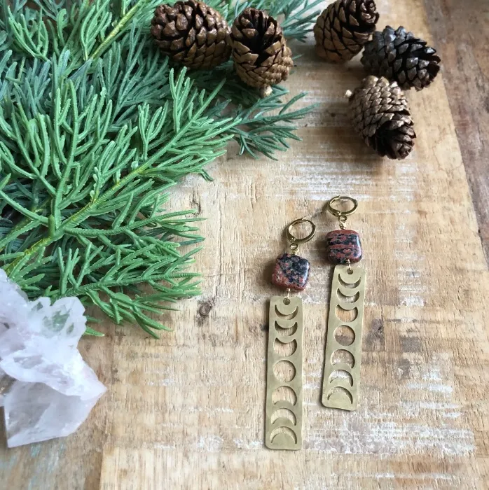 Hammered brass moon phase earrings with red snowflake jasper